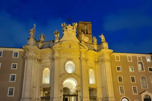Facade and monastery of Santa Croce in Gerusalemme beneath the evening sky, Rome